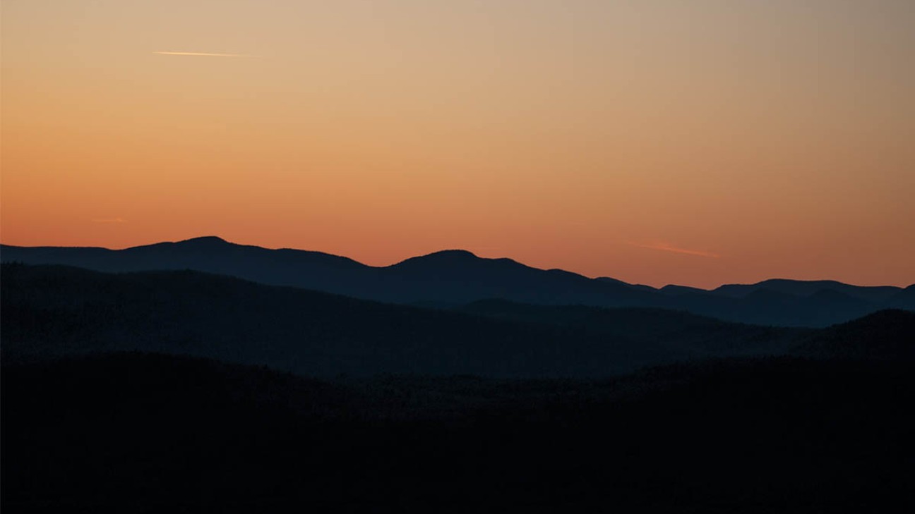 gravel biking with bob olden - a photo of a sunset over mountains