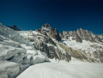 Giving Tuesday featured image for KUHL - a snow covered mountain with dark-blue sky