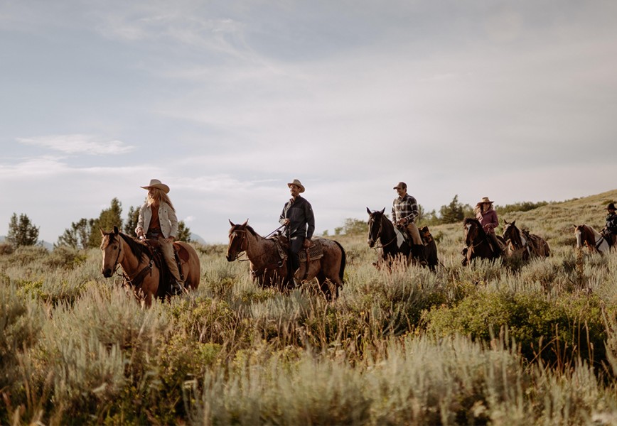 Reining in a Passions - Horse riders riding on a prairie 