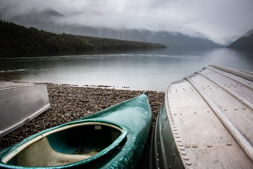 green kayak near body of water