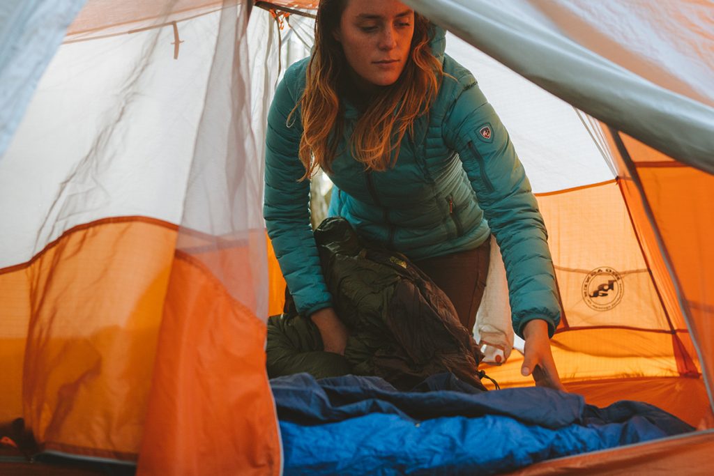 Girl in Kuhl Jacket In Orange Tent