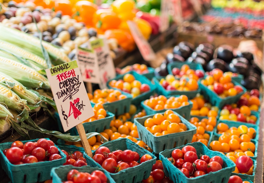 Red tomato lot on blue baskets