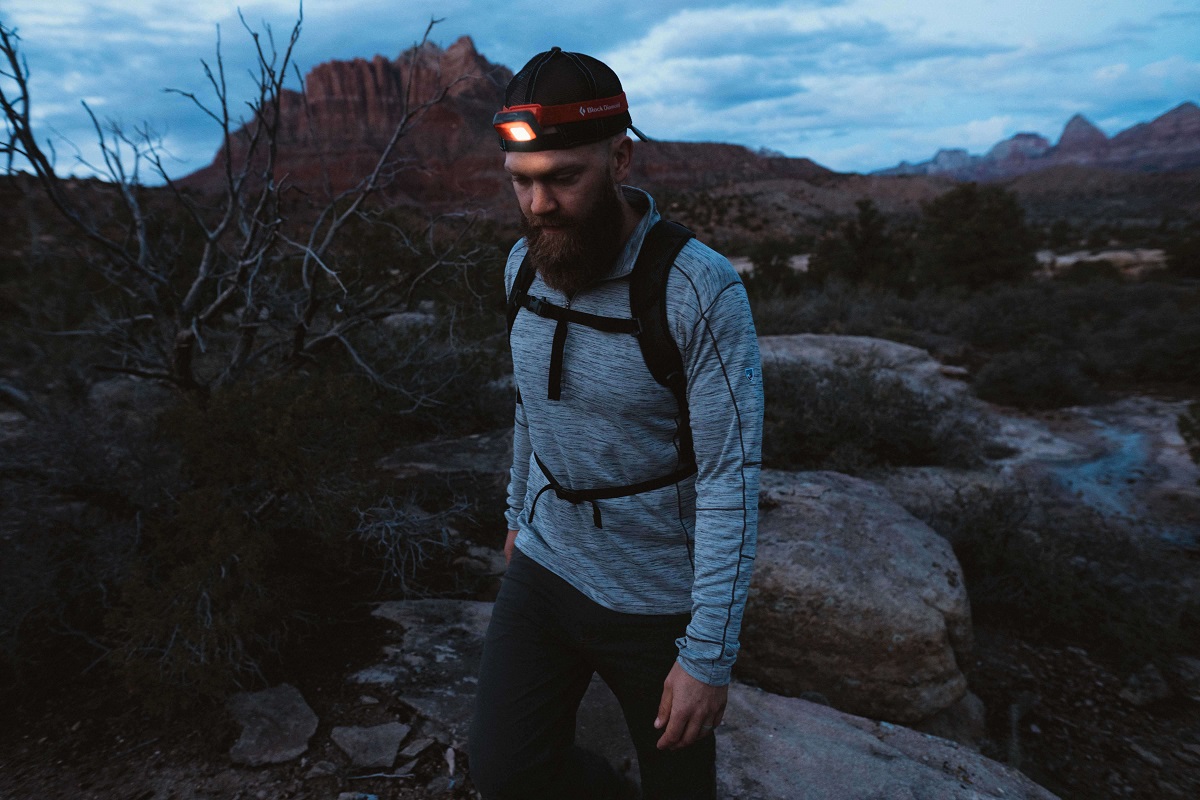 man walking with a head lamp