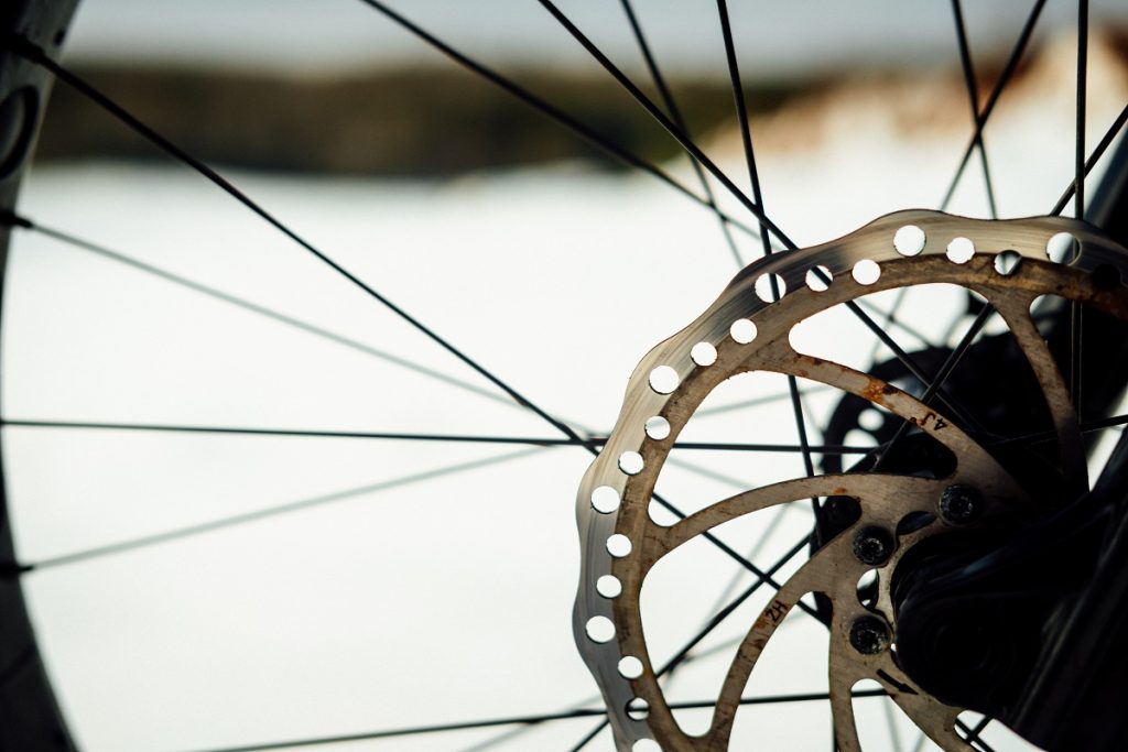 rusty bike rotor on snow