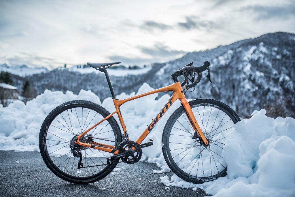 yellow and black mountain bike in snow