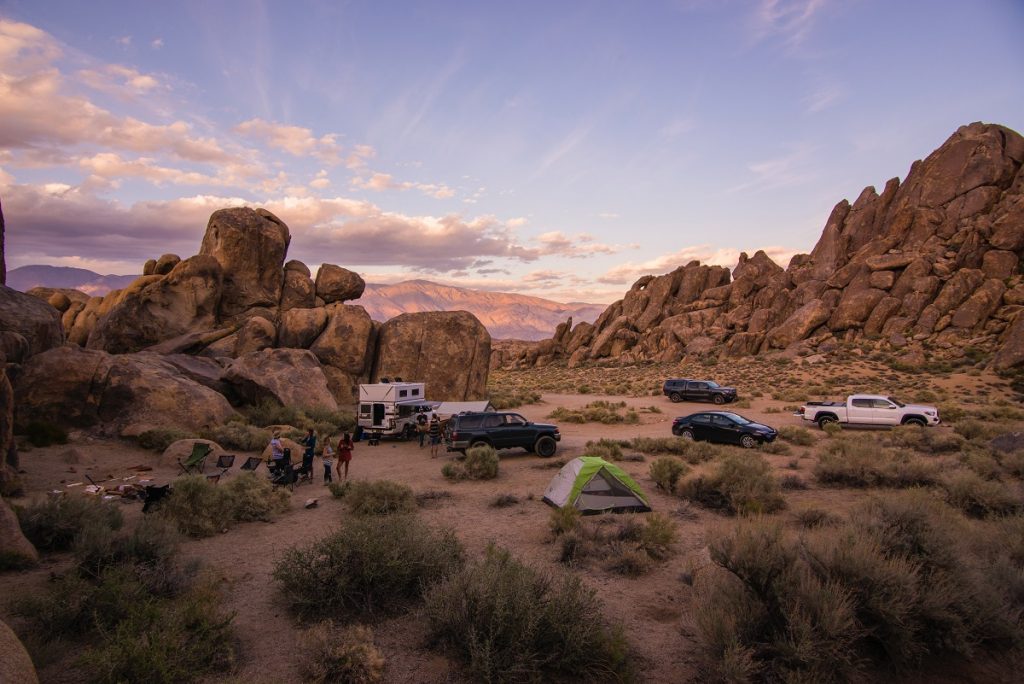 vehicles surrounded by mountains