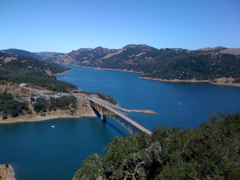 a bridge over blue body of water