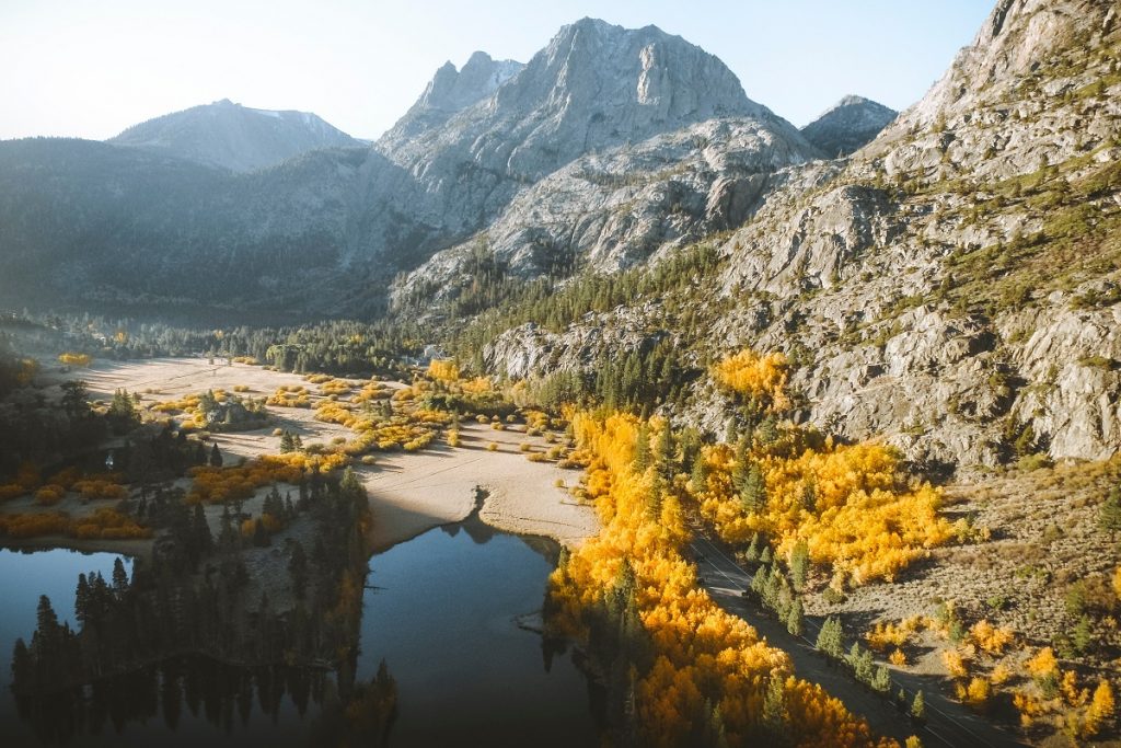 water surrounded by trees and mountains