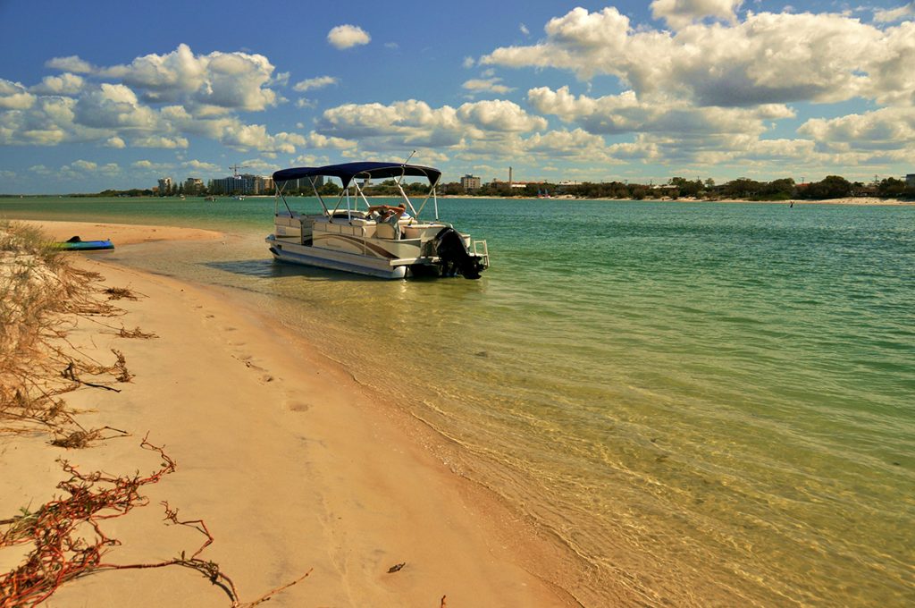 pontoon parked on the beach during daytime