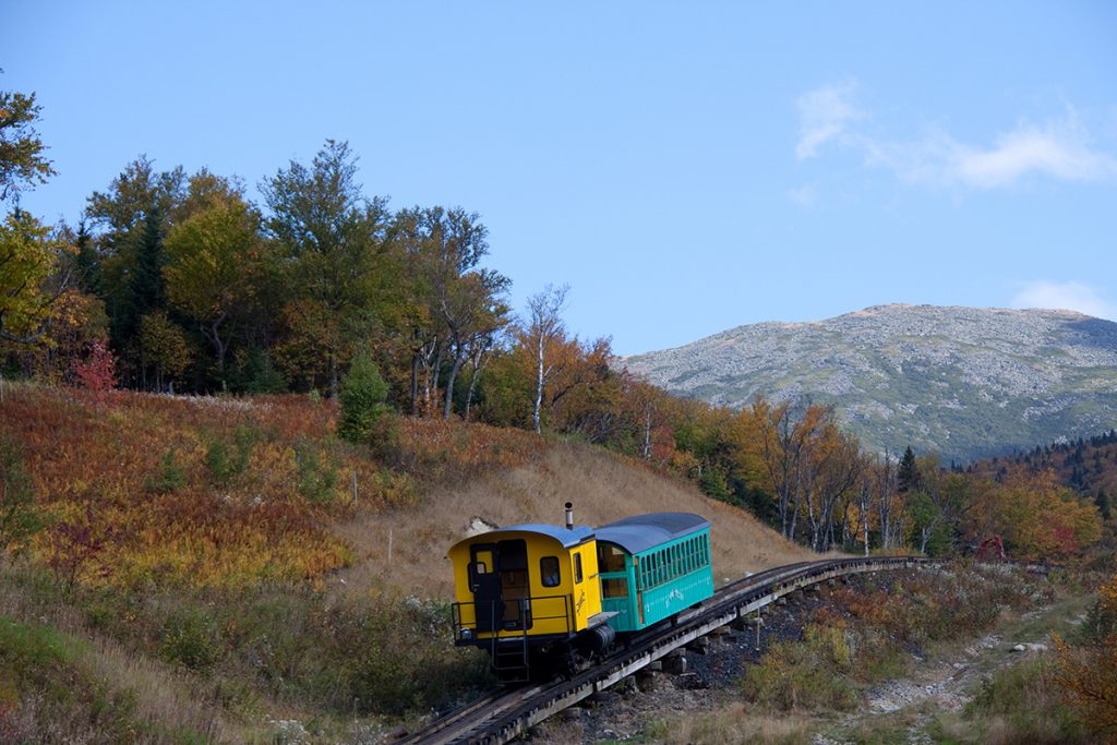 yellow and blue trail passing through mountains