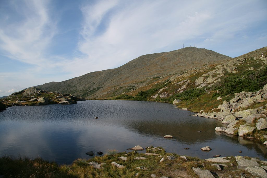 body of water near a mountain