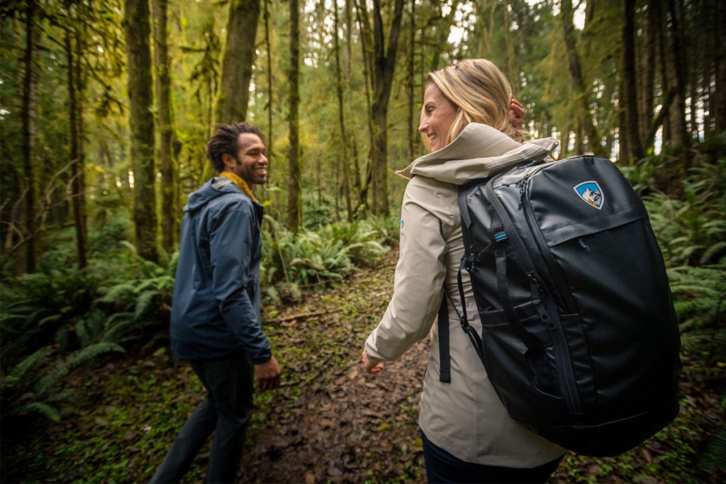 Woman backpacking with KUHL backpack