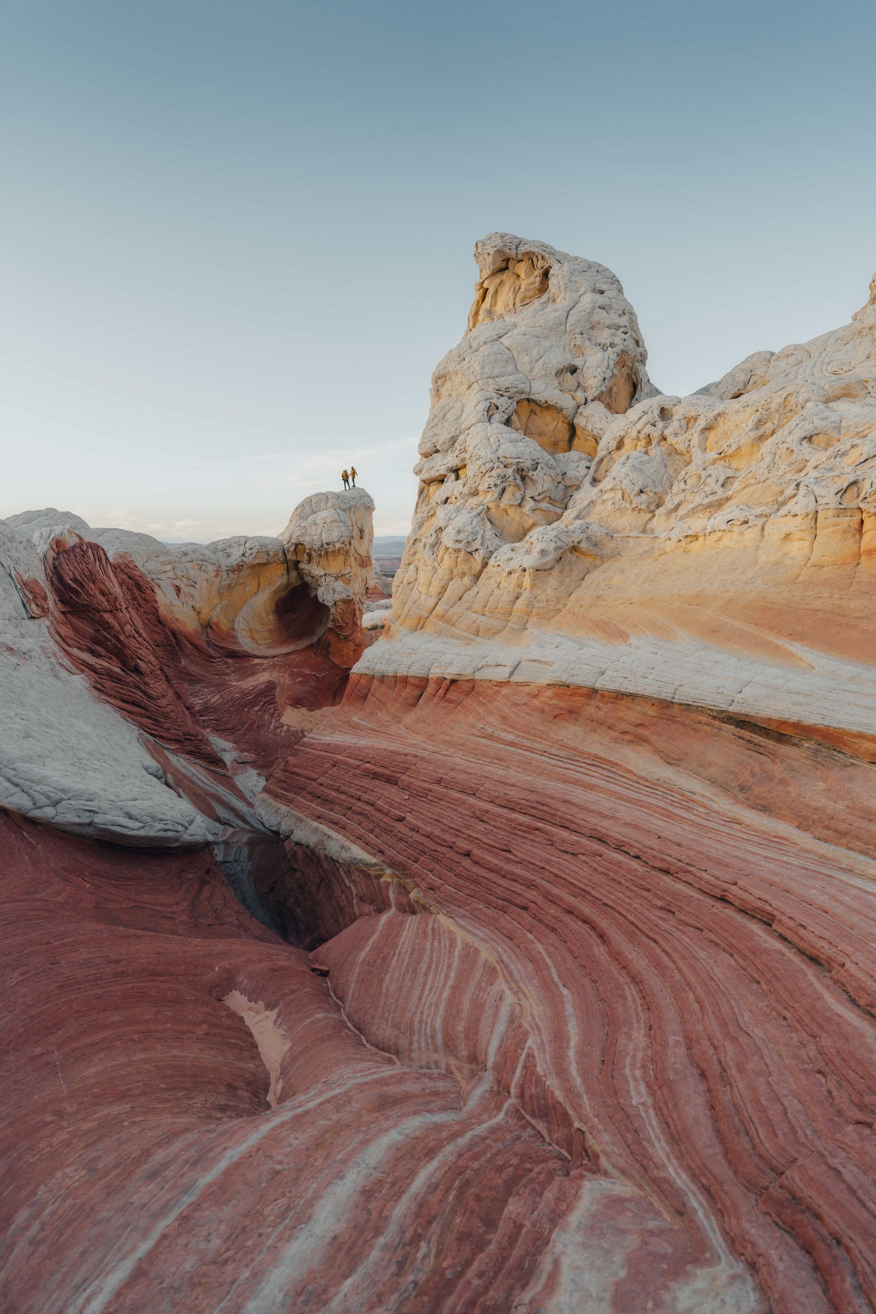 Two men standing on a rock at White Pocket Arizona Flats