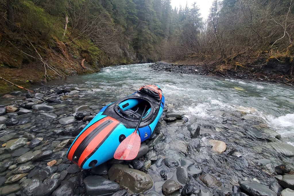 Packraft on the rocky shore 